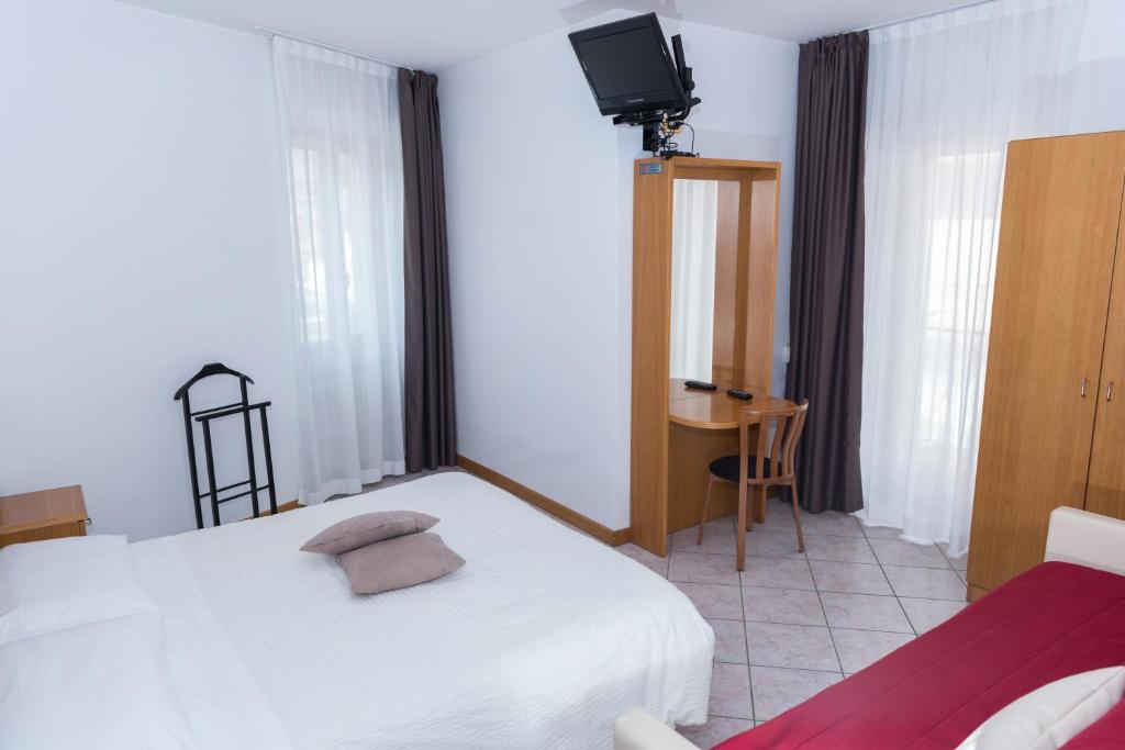 Postel nebo postele na pokoji v ubytování Albergo Ristorante Da Neni