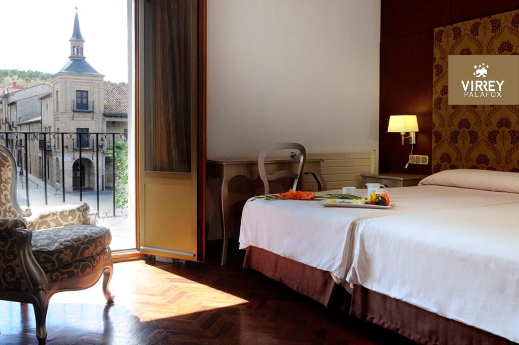 Postel nebo postele na pokoji v ubytování Hotel II Virrey
