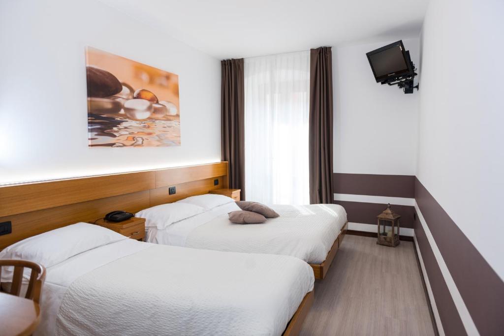 Postel nebo postele na pokoji v ubytování Albergo Ristorante Da Neni