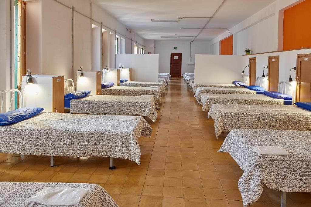 Postel nebo postele na pokoji v ubytování Albergue Seminario Menor