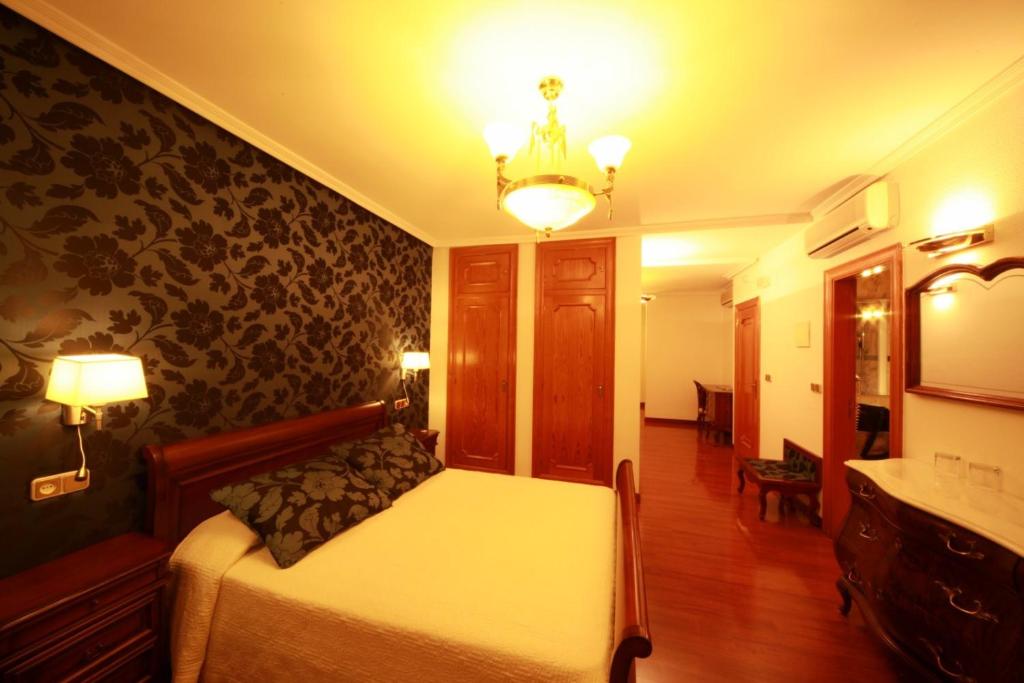 Postel nebo postele na pokoji v ubytování Hotel II Virrey