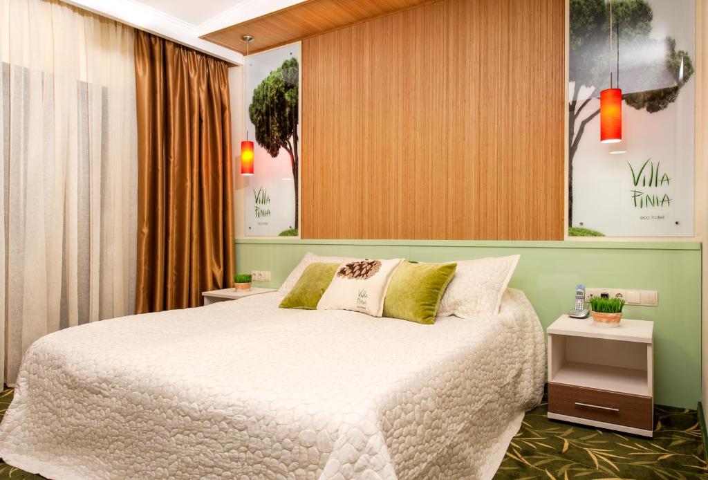 Postel nebo postele na pokoji v ubytování Villa Pinia Eco-hotel