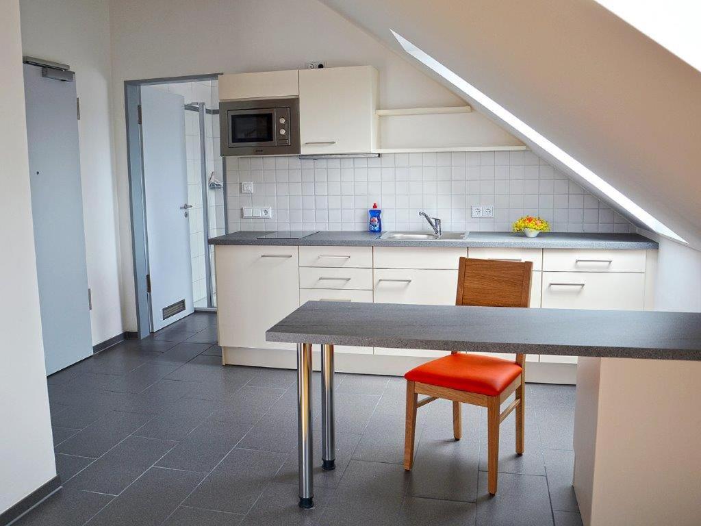 Kuchyň nebo kuchyňský kout v ubytování Apparthotel Ampertal