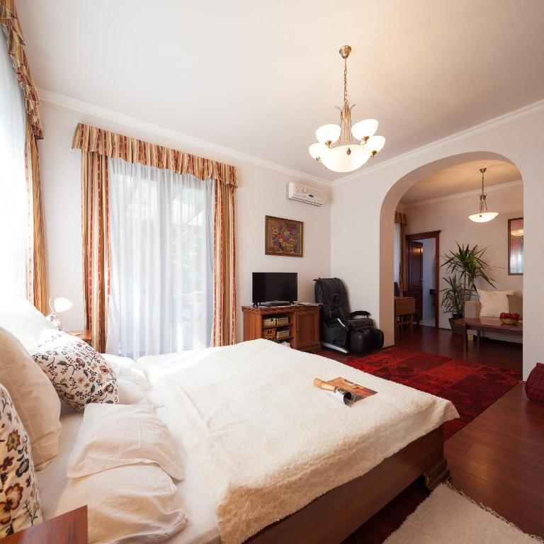 Postel nebo postele na pokoji v ubytování Villa Cecile