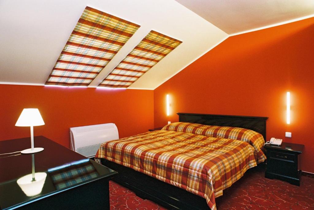 Postel nebo postele na pokoji v ubytování Park Hotel Tartuf