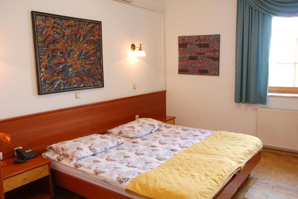 Postel nebo postele na pokoji v ubytování Guest House Arvaj