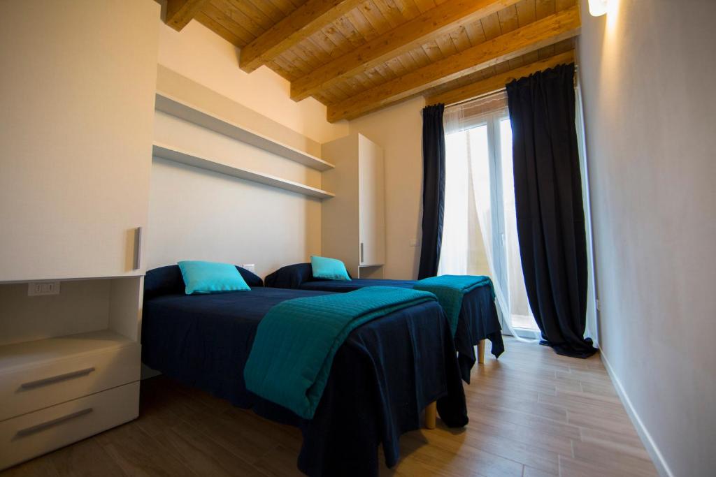 Postel nebo postele na pokoji v ubytování Camping Bergamini