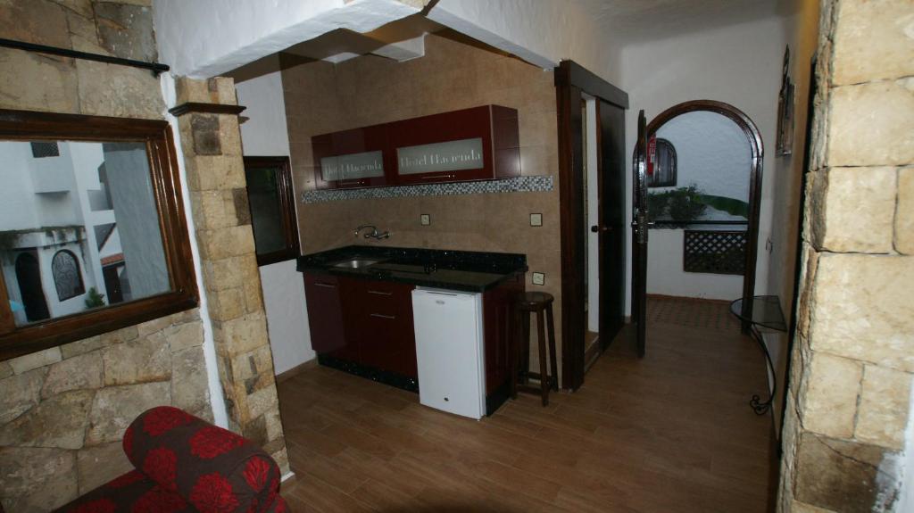 Kuchyň nebo kuchyňský kout v ubytování Hotel Hacienda
