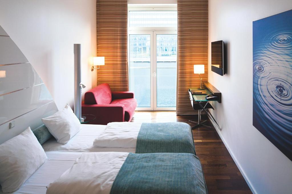 Postel nebo postele na pokoji v ubytování Copenhagen Island Hotel