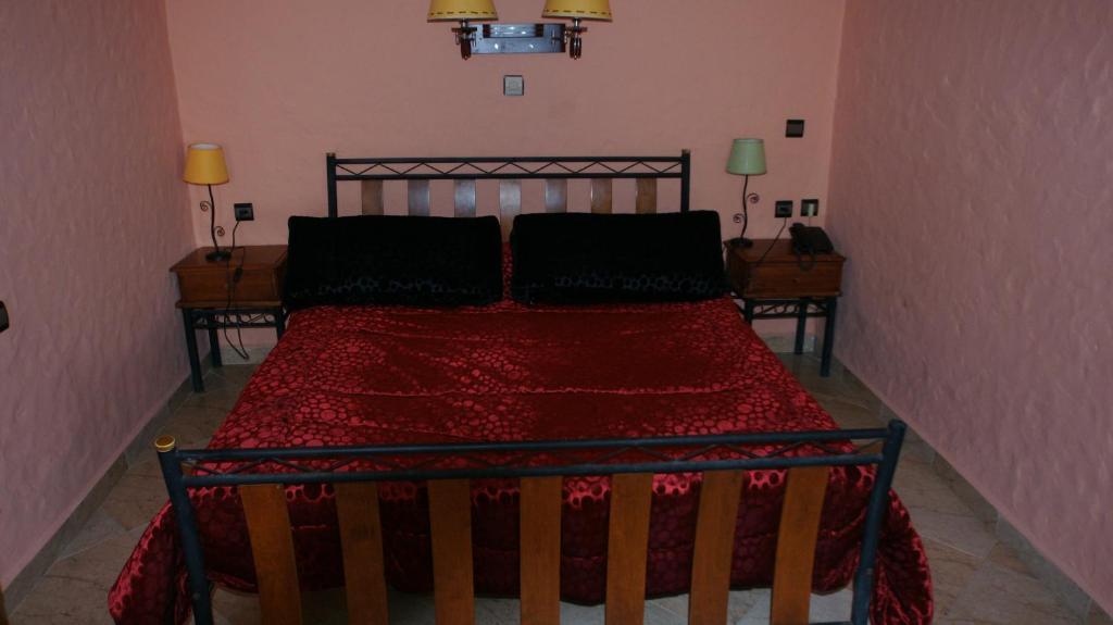 Postel nebo postele na pokoji v ubytování Hotel Hacienda