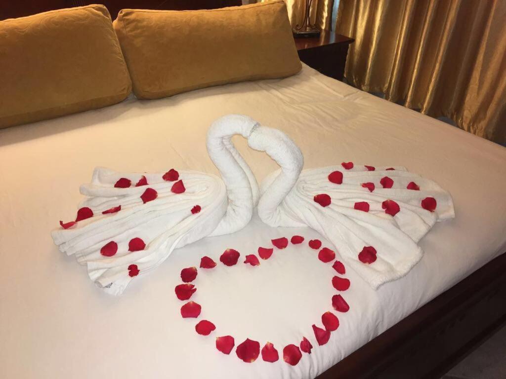 Postel nebo postele na pokoji v ubytování Hotel Hacienda