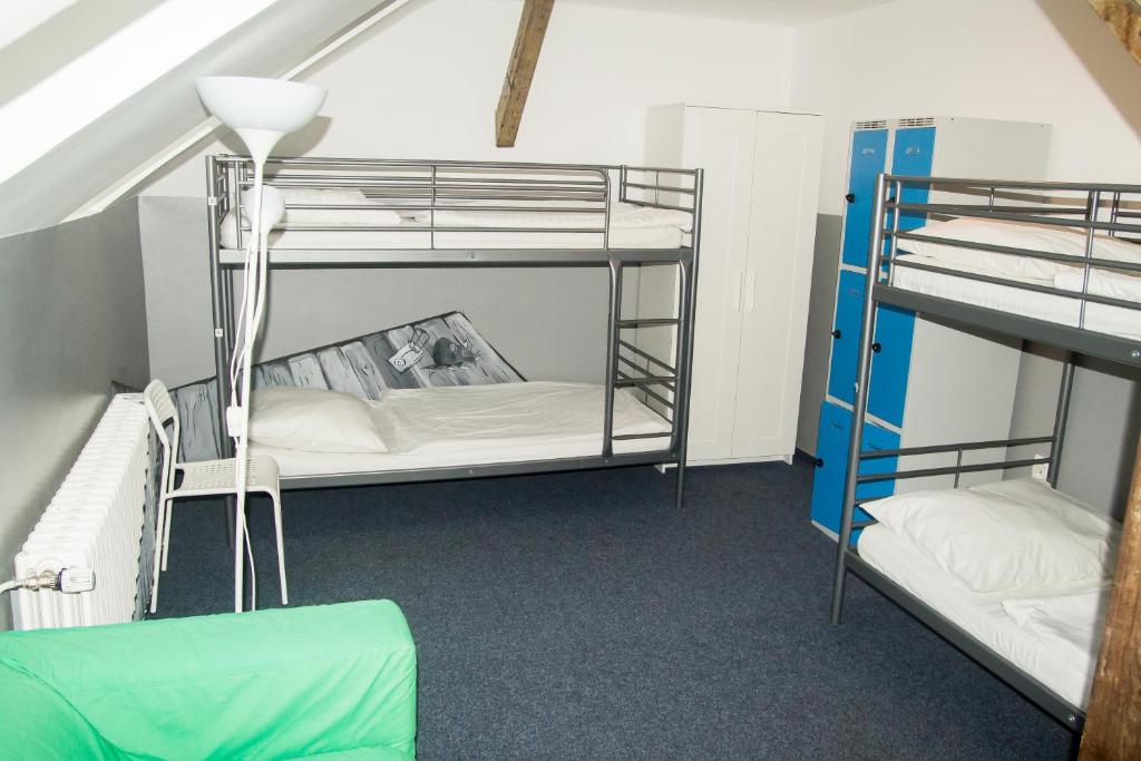 Una cama o camas en una habitación de Hostel Franz Kafka