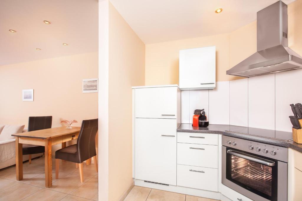 Kuchyň nebo kuchyňský kout v ubytování AlpinAppartements Stöckl