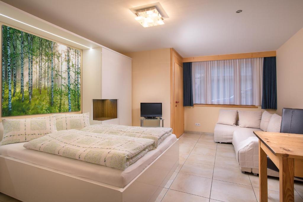 Postel nebo postele na pokoji v ubytování AlpinAppartements Stöckl