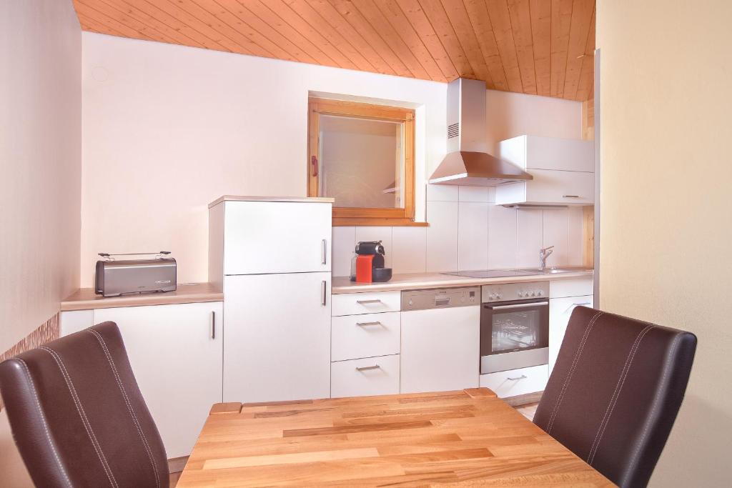 Kuchyň nebo kuchyňský kout v ubytování AlpinAppartements Stöckl