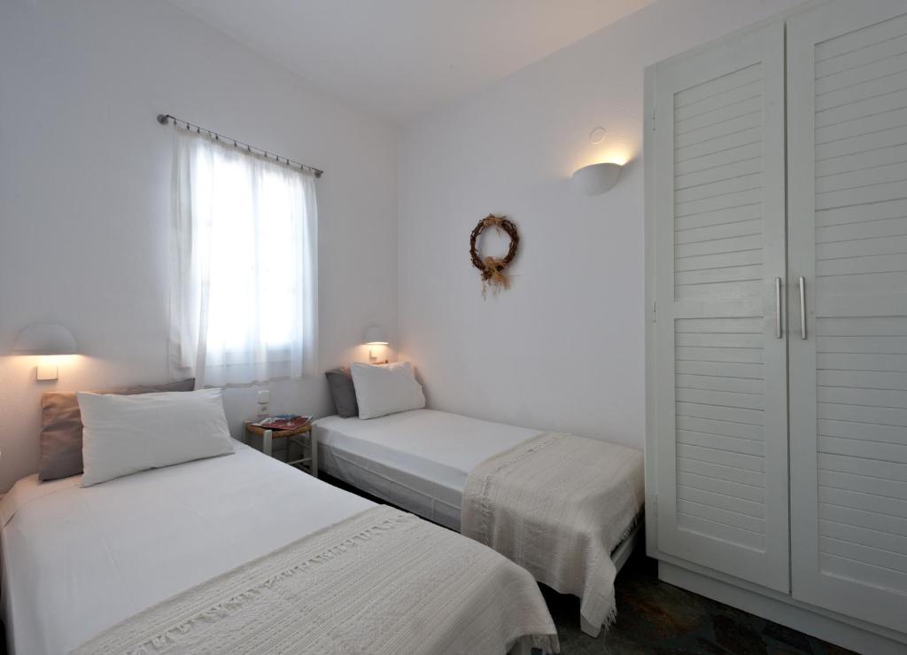 Postel nebo postele na pokoji v ubytování Archipelagos Apartments
