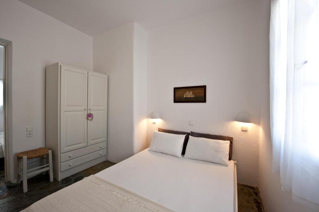 Postel nebo postele na pokoji v ubytování Archipelagos Apartments