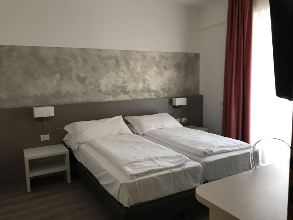 Postel nebo postele na pokoji v ubytování Hotel Piccolo Mondo