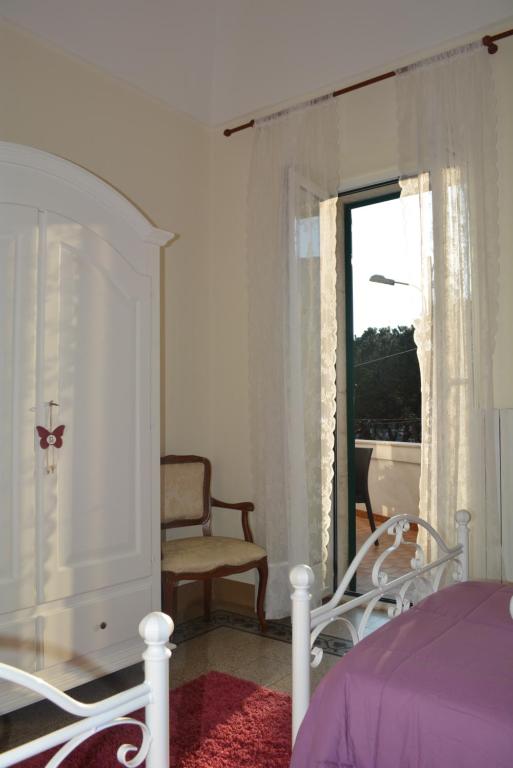 Łóżko lub łóżka w pokoju w obiekcie Casa Il Campanile