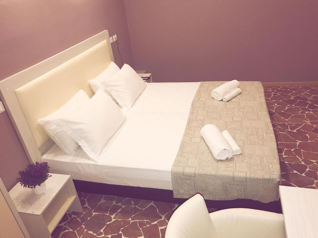 Posteľ alebo postele v izbe v ubytovaní Hotel Paganini