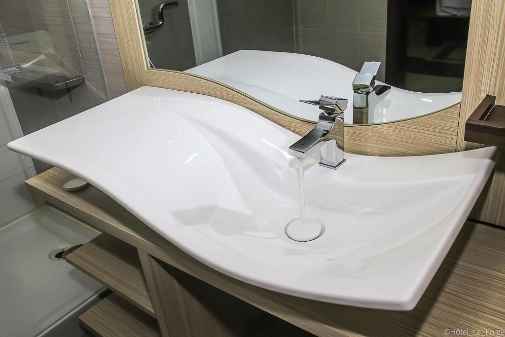 Koupelna v ubytování Hotel LAFORGE