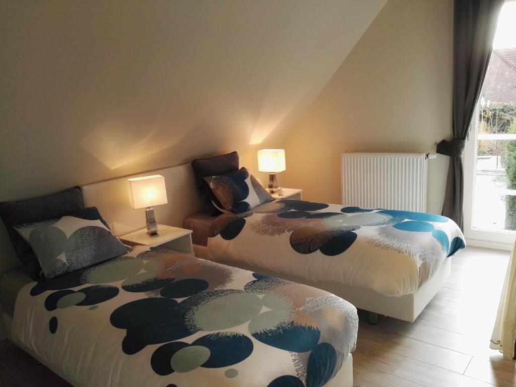 Postel nebo postele na pokoji v ubytování Archipel Holiday Cottage