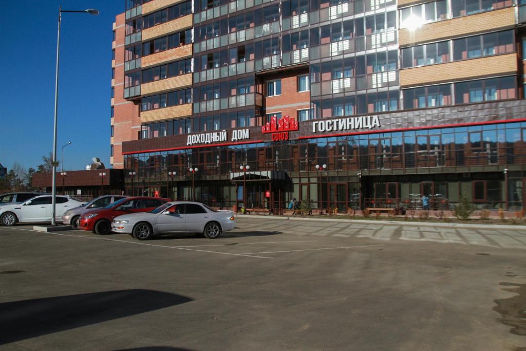 
a car is parked in front of a building at Hotel Soyuz in Irkutsk
