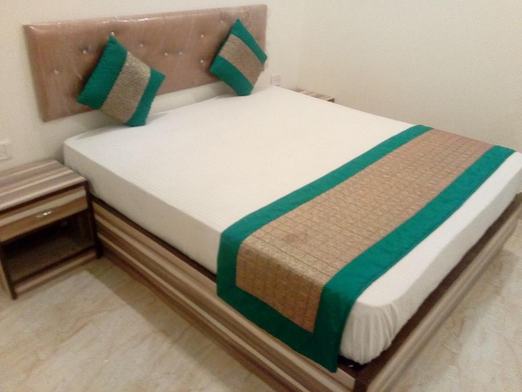 a small bed in a small room at Hotel Marina Aerocity FREE Airport Drop in New Delhi