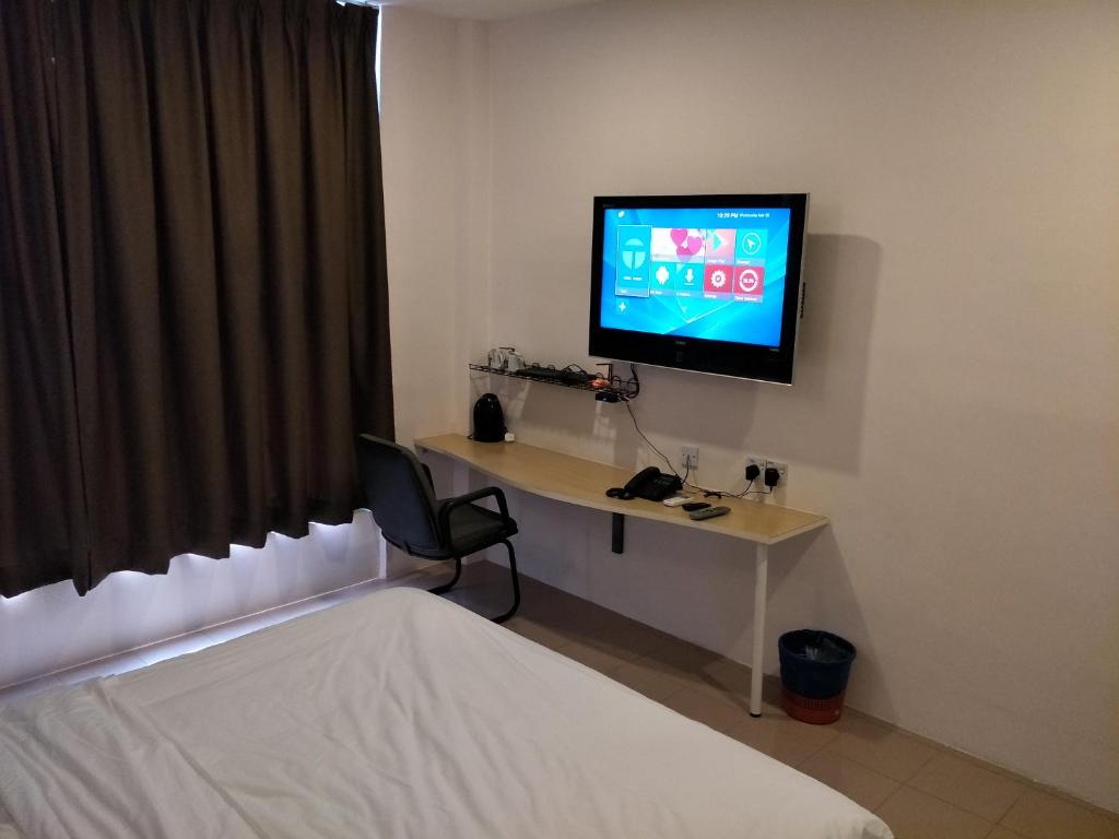 TV a/nebo společenská místnost v ubytování Anderson Hotel