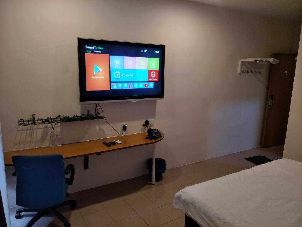 TV a/nebo společenská místnost v ubytování Anderson Hotel