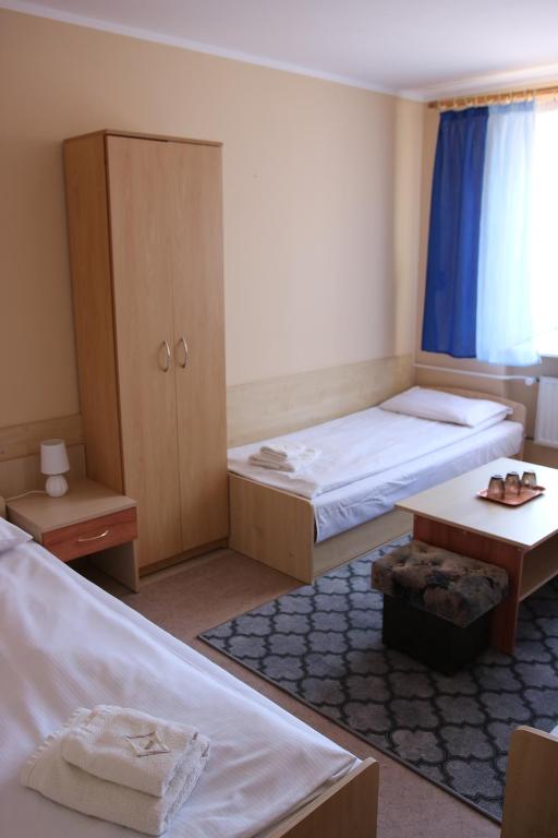 Posteľ alebo postele v izbe v ubytovaní Dom Litewski