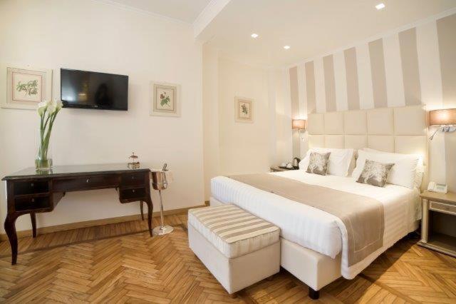 Postel nebo postele na pokoji v ubytování Hotel Jolanda