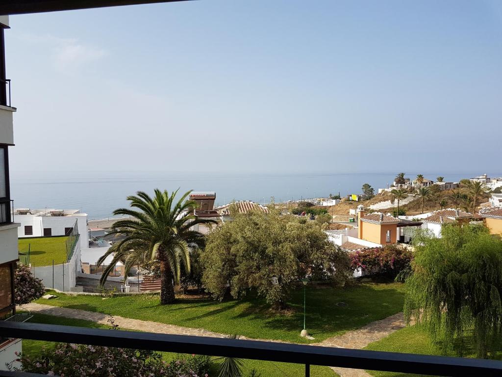a view of the ocean from the balcony of a house at El peñoncillo in Torrox Costa