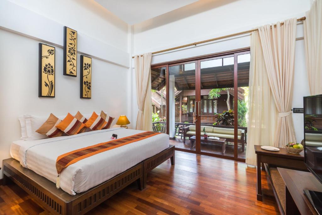 Postel nebo postele na pokoji v ubytování Samui Paradise Chaweng Beach Resort