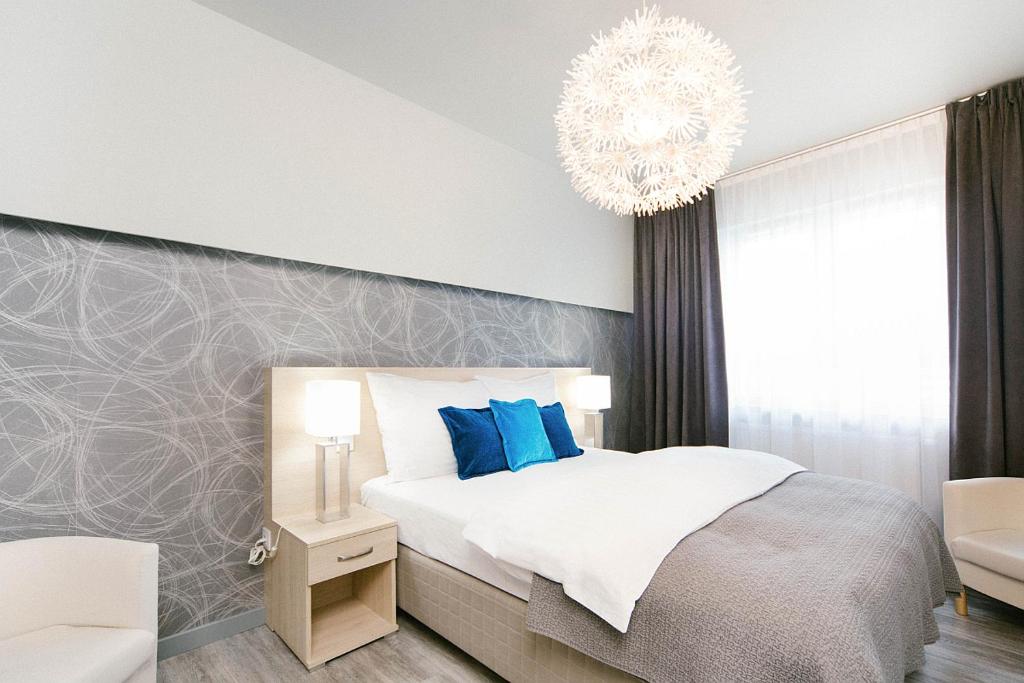 Posteľ alebo postele v izbe v ubytovaní ActivPark Apartments