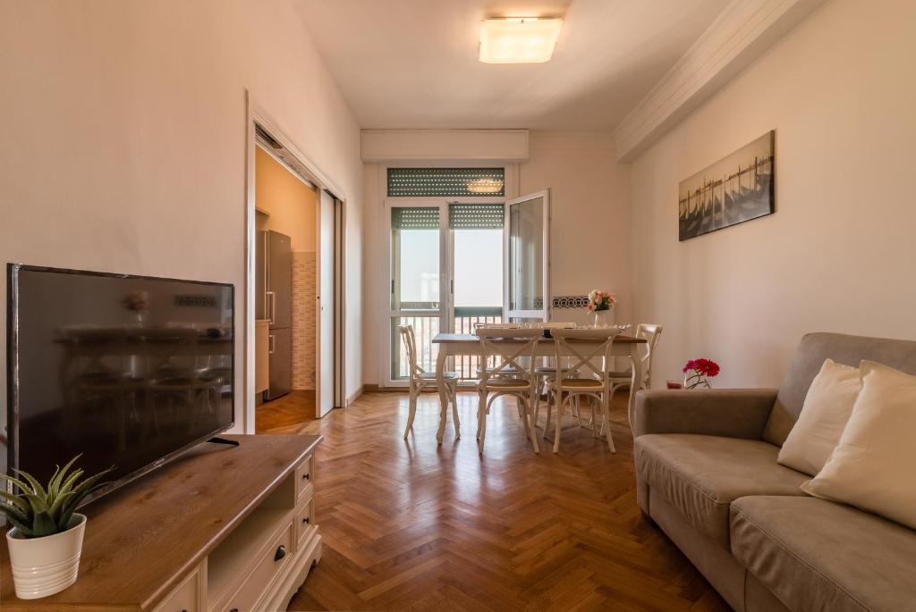 a living room with a couch and a table at PADOVA TOWER 13TH FLOOR in Padova