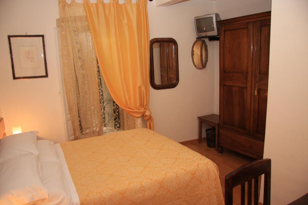 Postel nebo postele na pokoji v ubytování Hotel Morlacchi