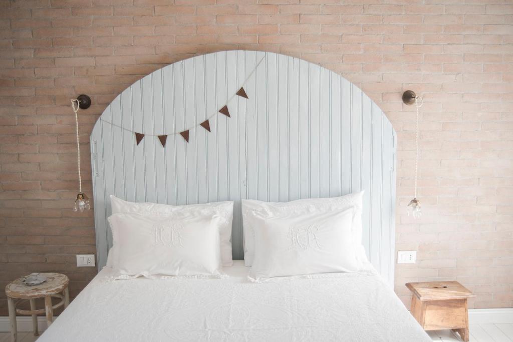Posteľ alebo postele v izbe v ubytovaní Le Molina B&B