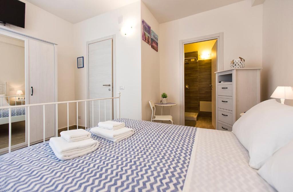 Posteľ alebo postele v izbe v ubytovaní White Charme Rooms