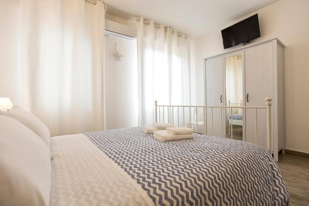 Posteľ alebo postele v izbe v ubytovaní White Charme Rooms