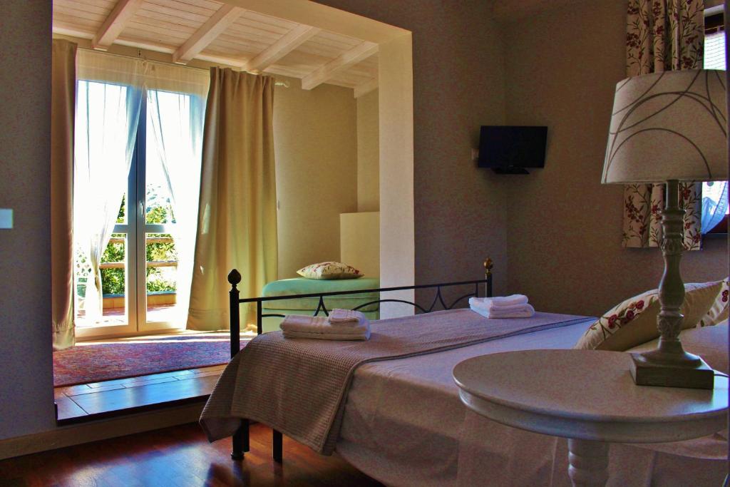 Postel nebo postele na pokoji v ubytování Tenuta EDONE' Country House
