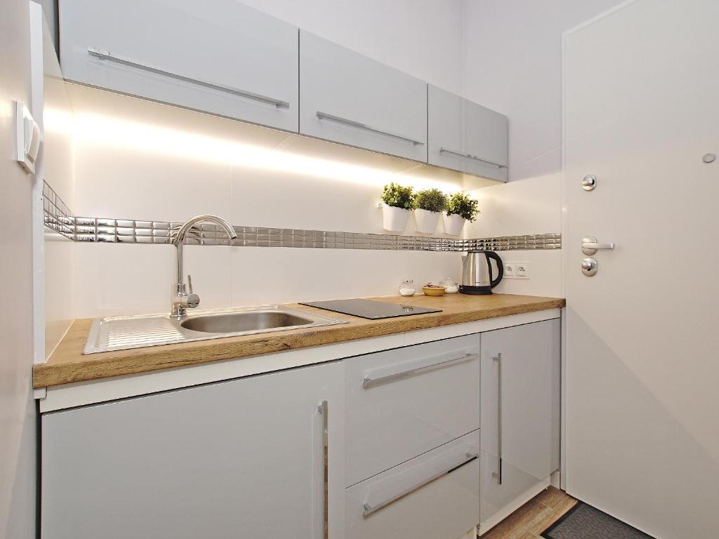 Kuchyňa alebo kuchynka v ubytovaní Apartament Starogdański 6