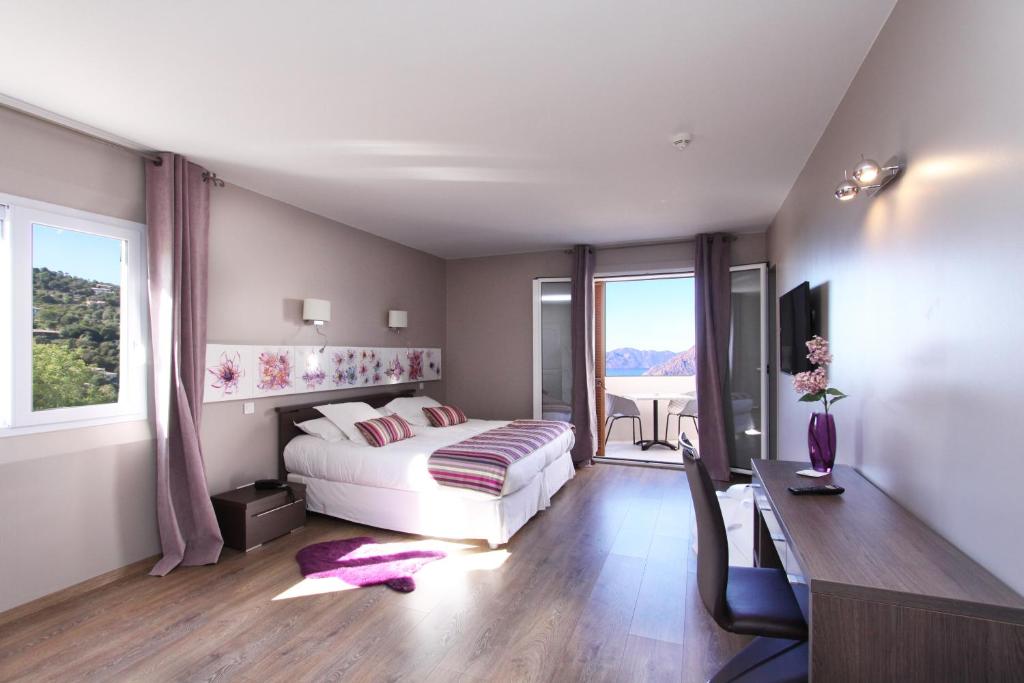 Postel nebo postele na pokoji v ubytování Hotel Scandola