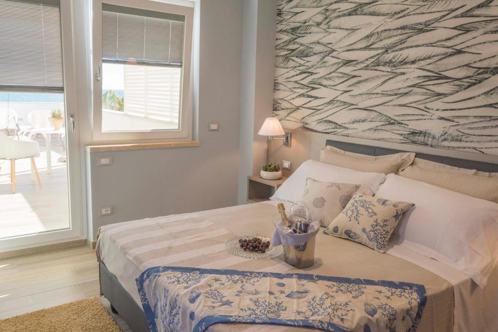 Postel nebo postele na pokoji v ubytování Hotel Miramare
