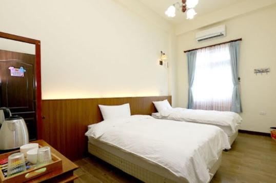 Postel nebo postele na pokoji v ubytování Hometown Times Homestay