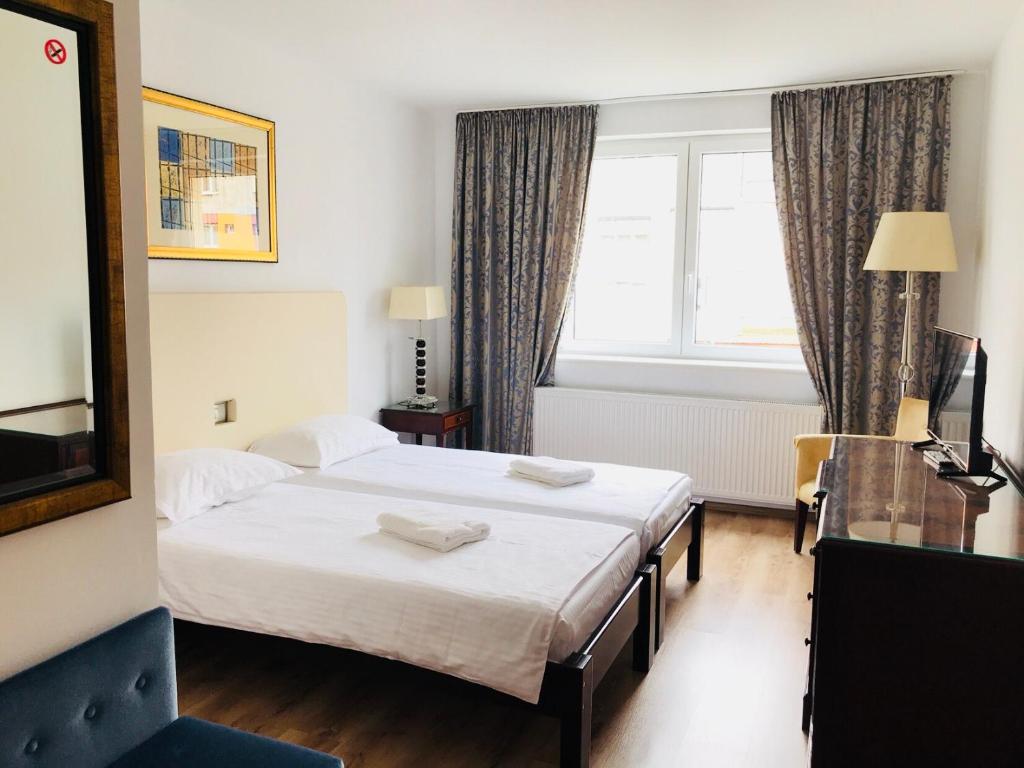 Postel nebo postele na pokoji v ubytování Hotel EKA