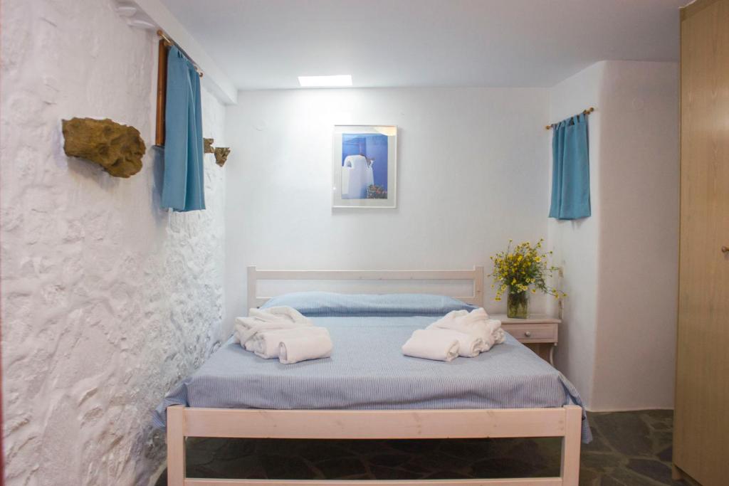 Postel nebo postele na pokoji v ubytování Sourmeli Garden Hotel