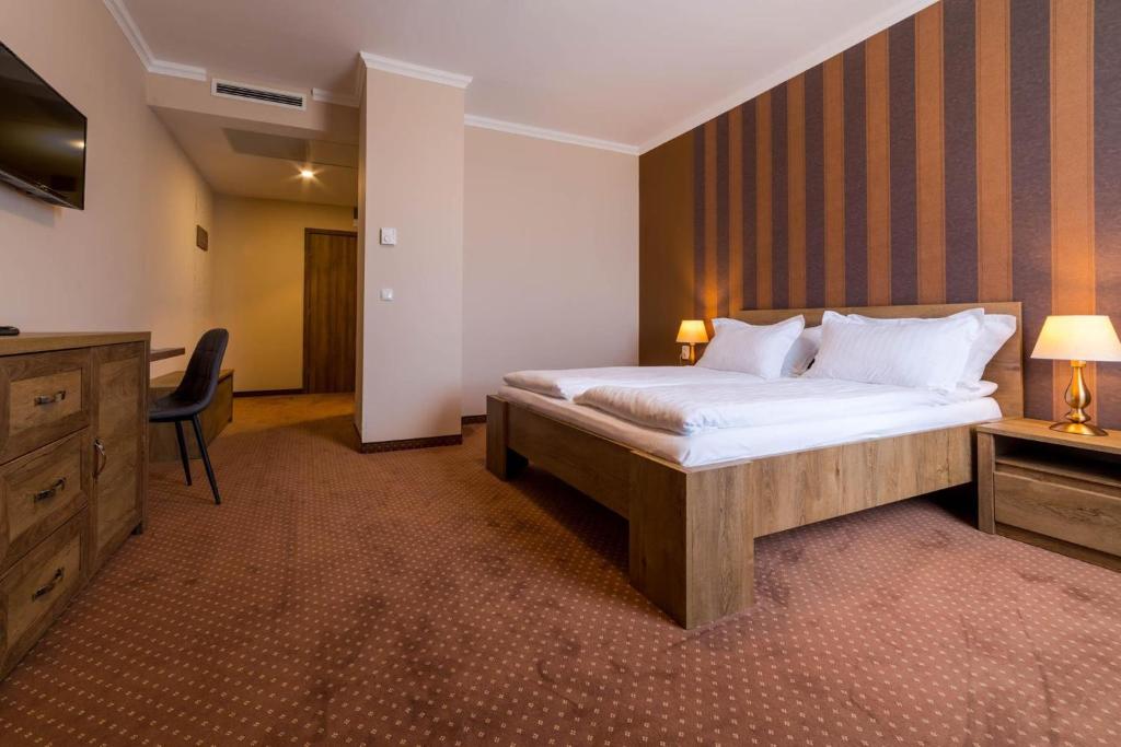 Postel nebo postele na pokoji v ubytování Sky Hotel
