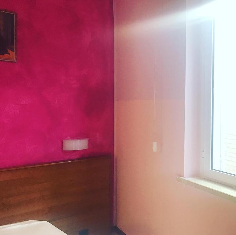Posteľ alebo postele v izbe v ubytovaní Hotel Pellegrino E Pace