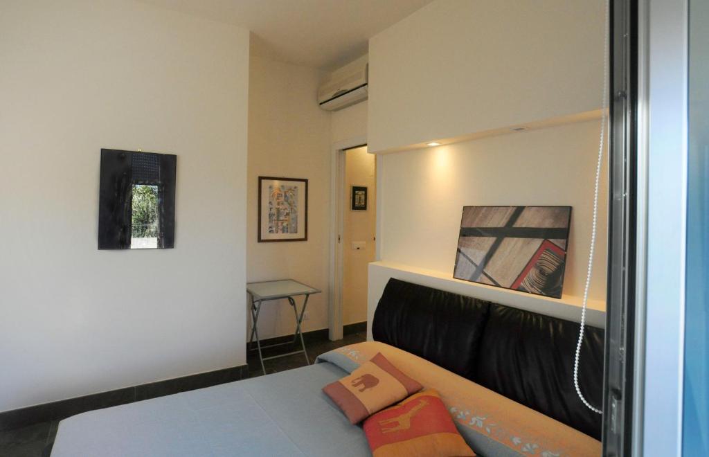 Letto o letti in una camera di Art House Quartu - Margine Rosso